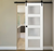 Nova 4-Lite Braga Bianco Matrix Laminated Modern Barn Door - Doors and Beyond